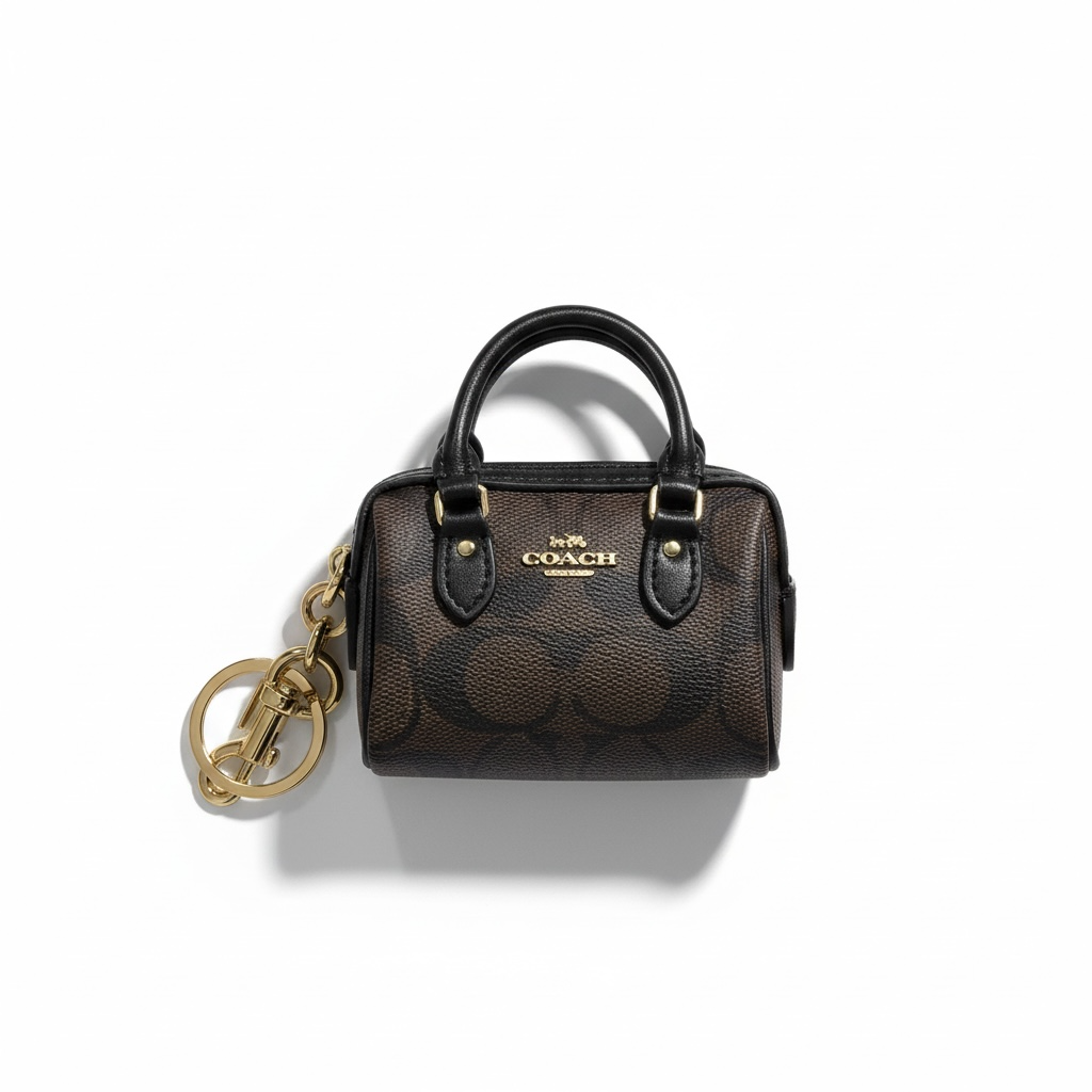 🤎 Coach Mini Signature Brown Bag Charm – Classic Elegance in Miniature Form ✨