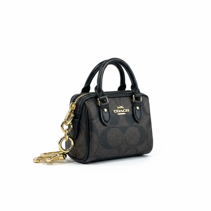 🤎 Coach Mini Signature Brown Bag Charm – Classic Elegance in Miniature Form ✨