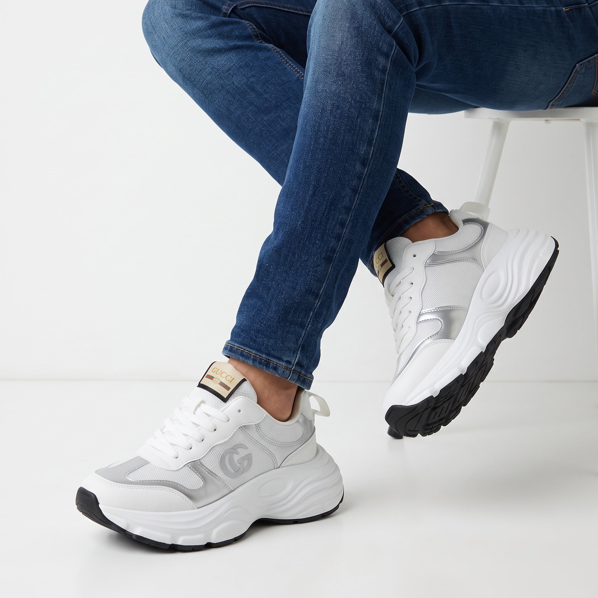 White and silver Gucci chunky sneakers with GG logo and platform sole