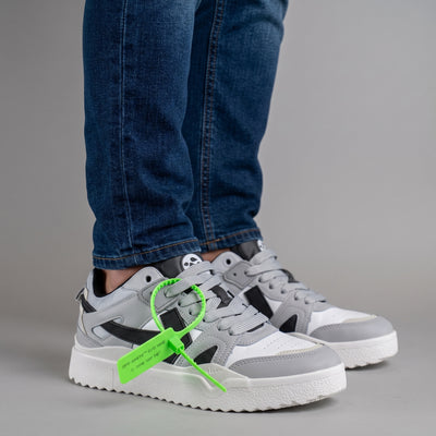 Off-White x Nike grey low-top sneakers with neon green zip tie