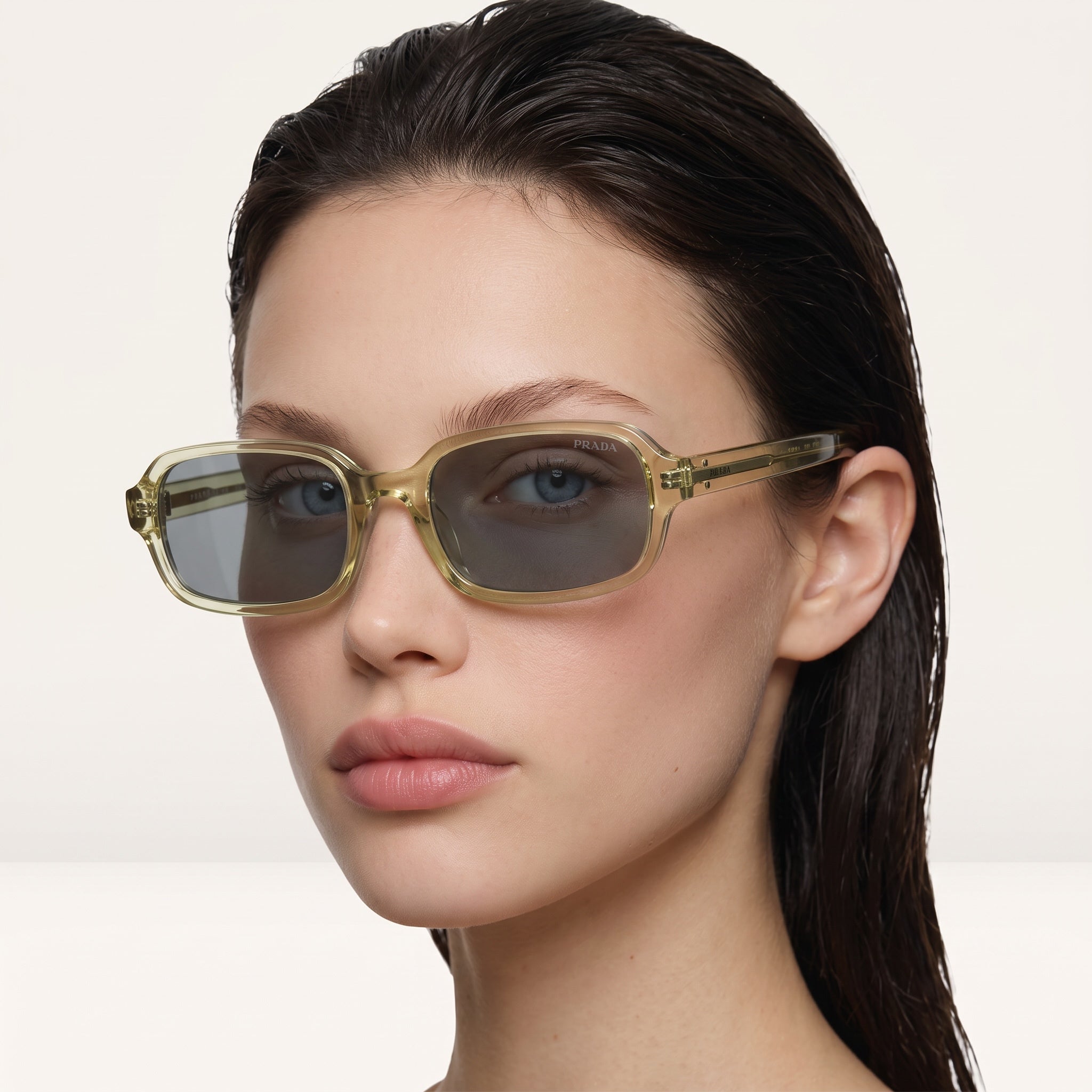 Prada square sunglasses with translucent green frame and grey lenses
