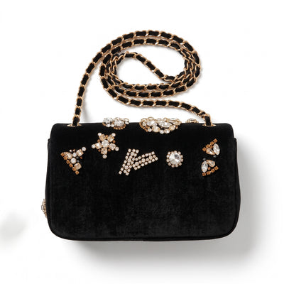 Chanel black velvet flap bag with jeweled embellishments and gold chain strap