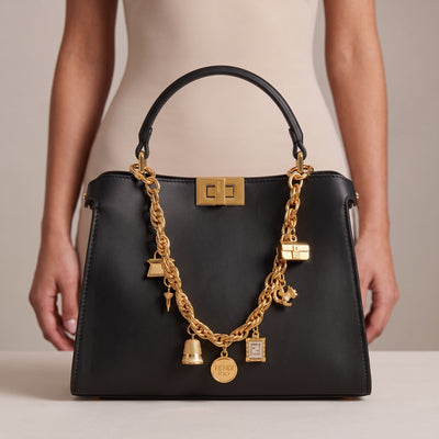 Black Fendi top-handle bag with gold chain charms and gold clasp