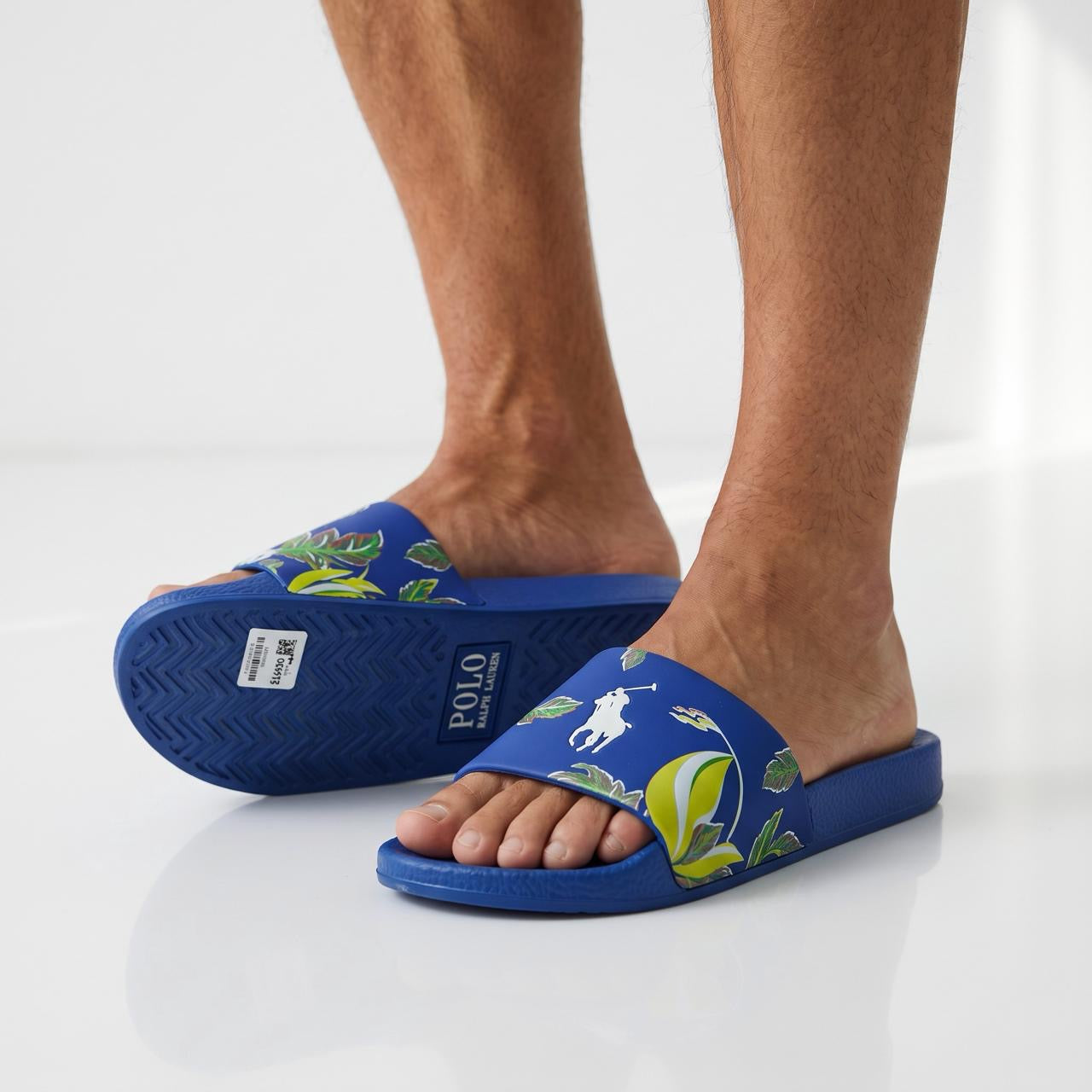 Blue Polo Ralph Lauren men's slide sandals with tropical floral print and white pony logo