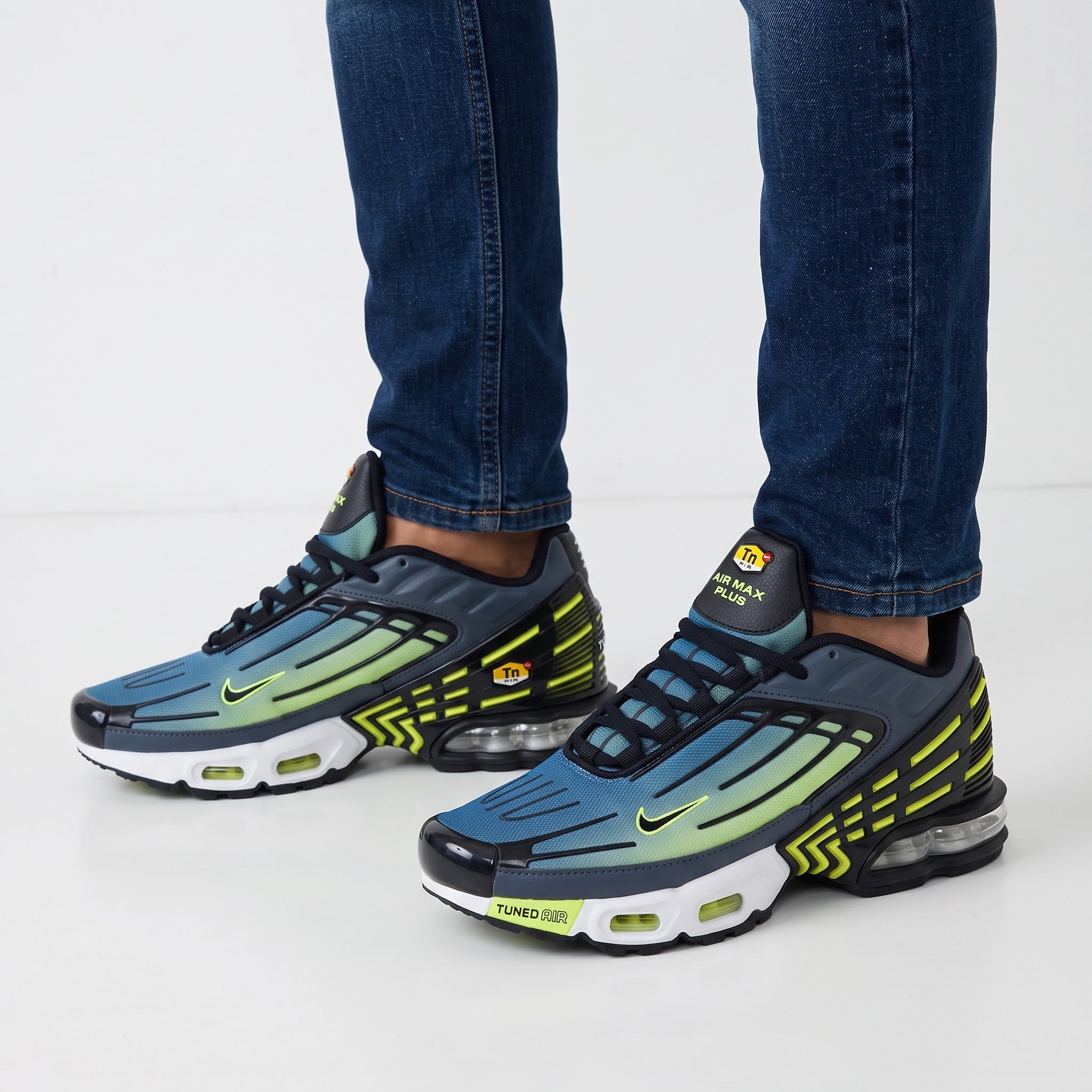Nike Air Max Plus blue to green gradient sneakers with neon accents