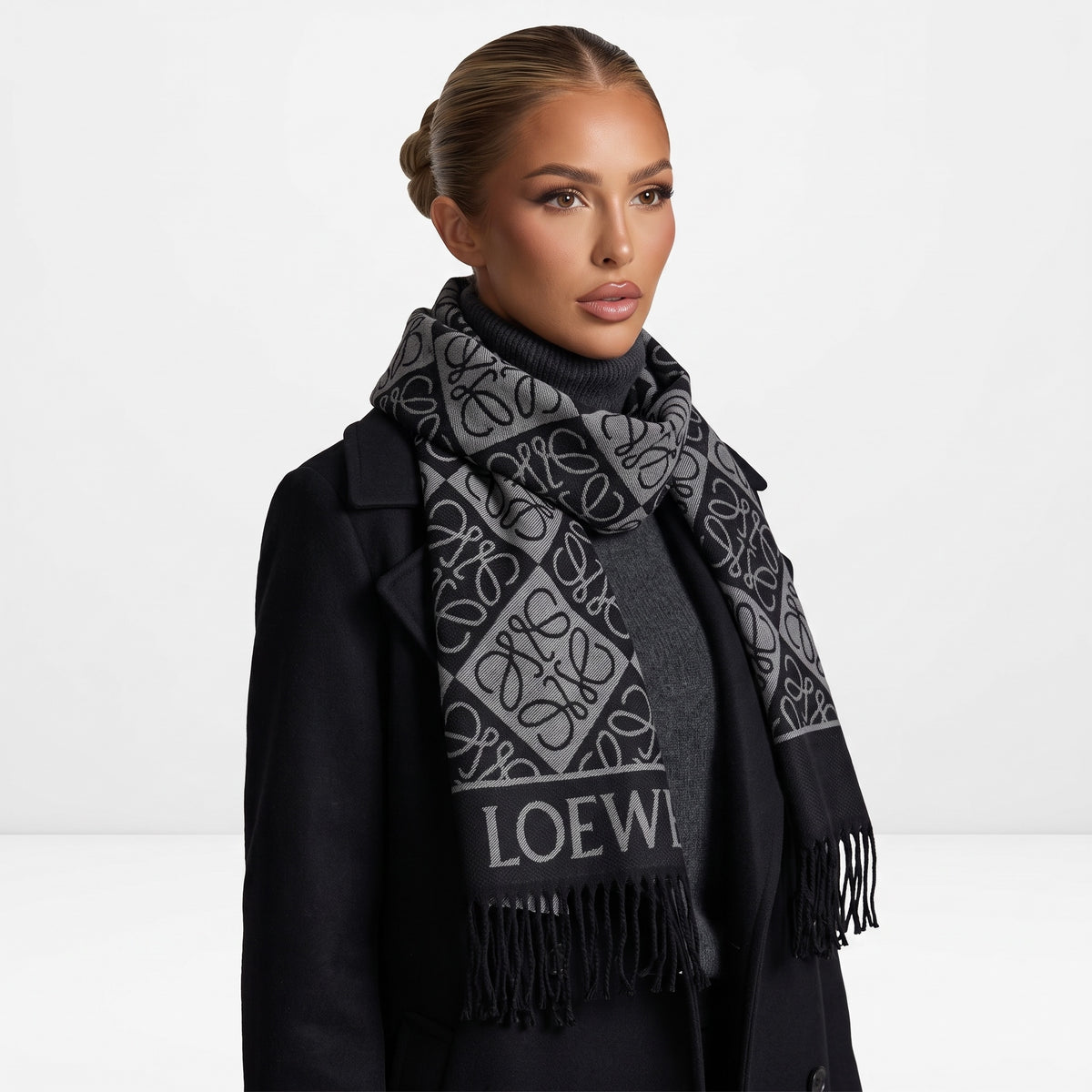Black and grey Loewe logo scarf with fringed ends draped around model