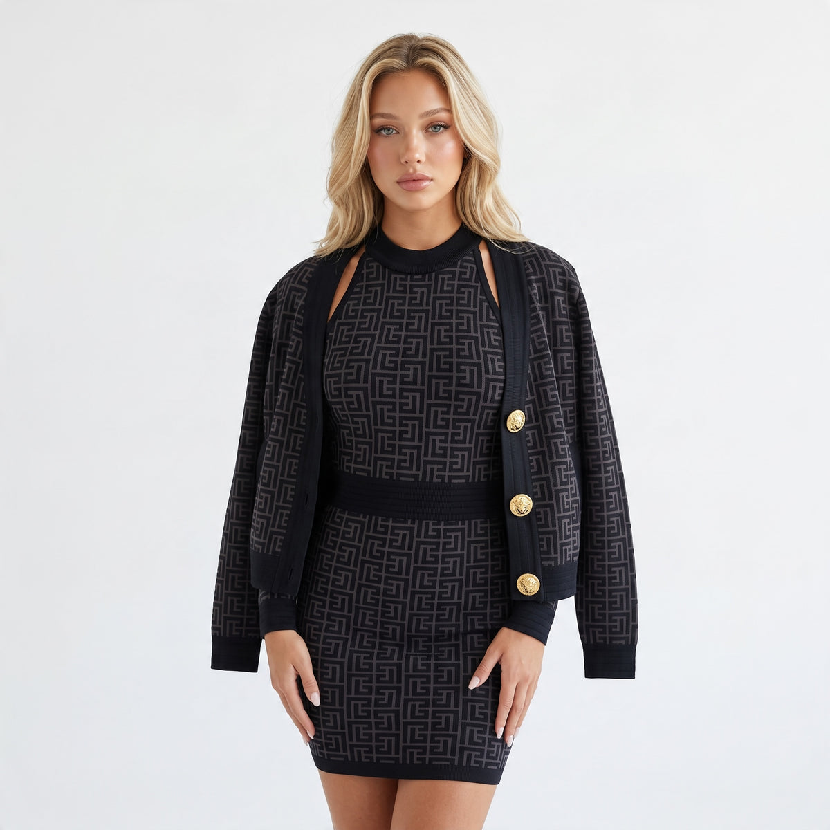 black halter fitted knit dress with tonal logo pattern and back zipper