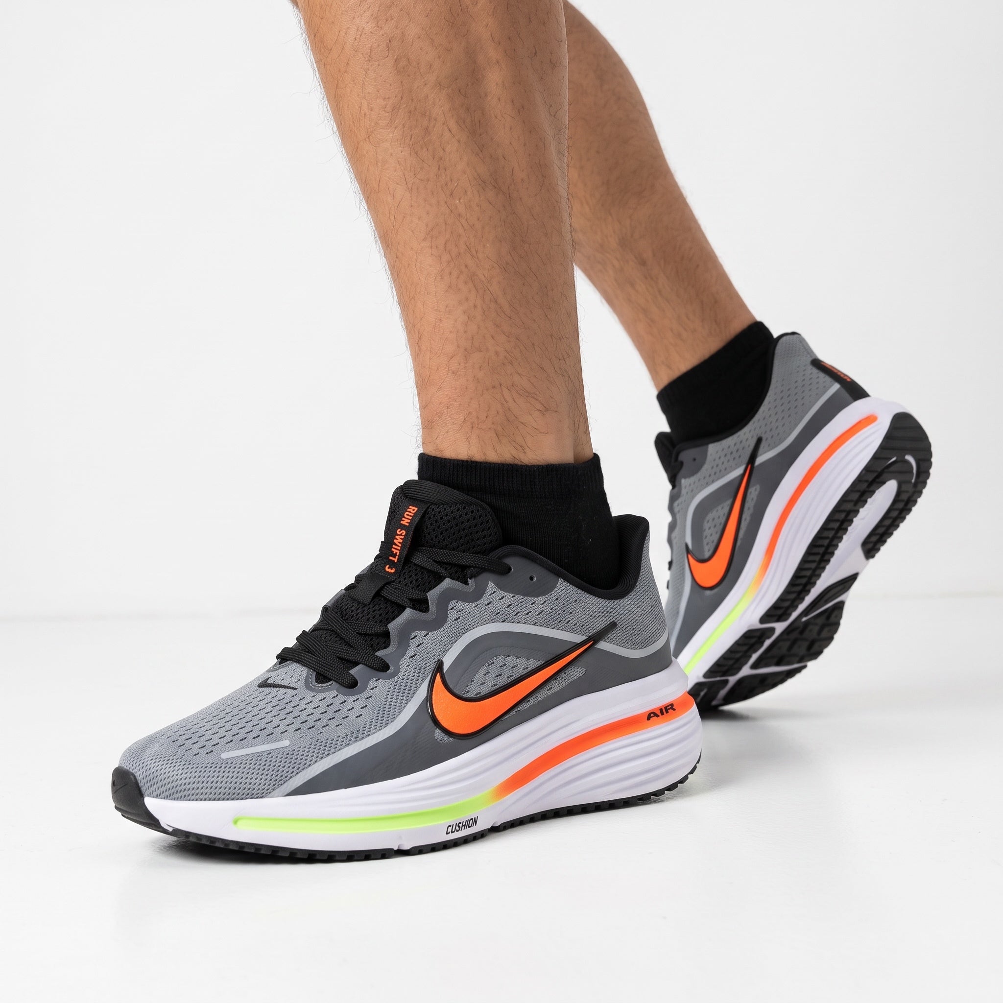 Nike Winflo 12 grey and orange running sneaker with white cushioned midsole