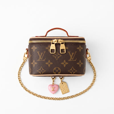 Louis Vuitton monogram vanity case with gold chain and heart charm