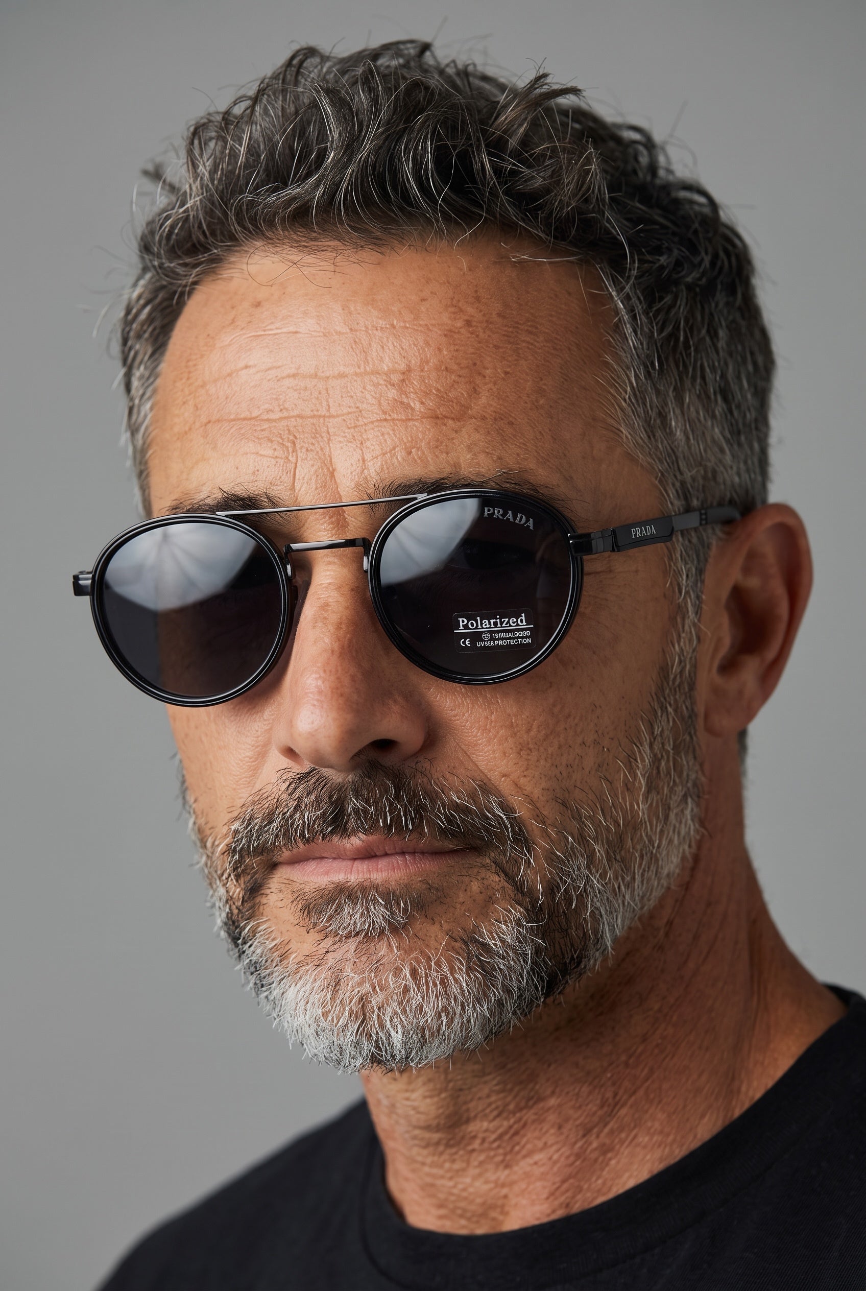 Prada black round sunglasses with double bridge and polarized dark lenses