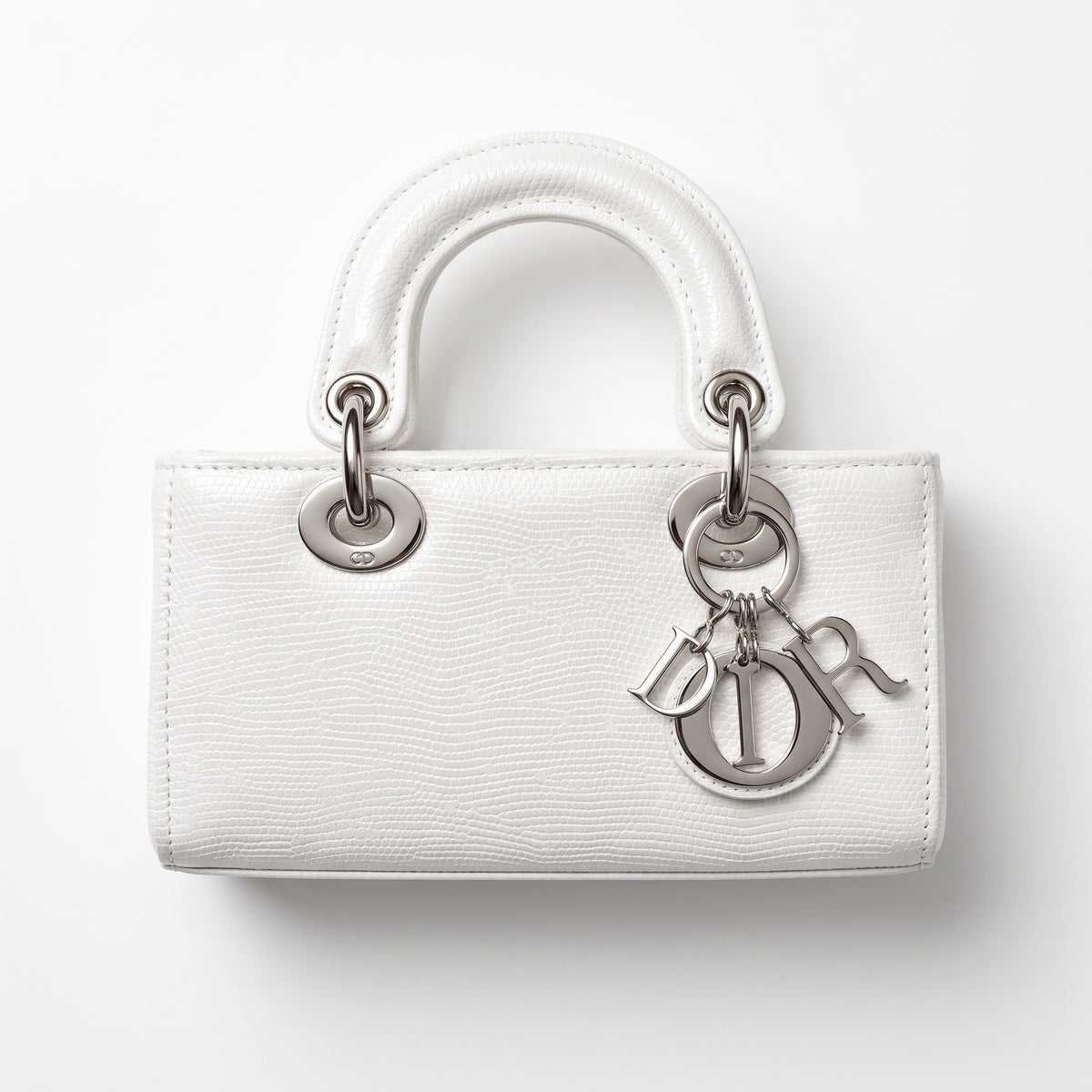 White Dior Lady Dior top-handle bag with silver hardware and Dior letter charms