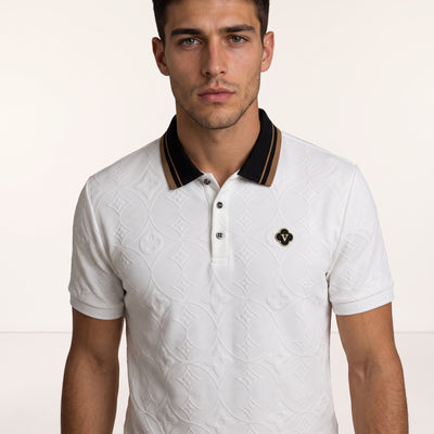 White Louis Vuitton embossed monogram polo with black and gold collar and chest badge