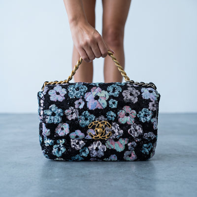 Chanel black sequin floral flap bag with gold twisted chain handle and CC turnlock
