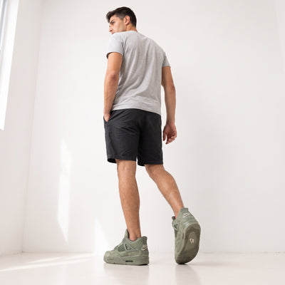 Olive green Air Jordan 4 sneakers with Jumpman tongue and NIKE AIR heel branding