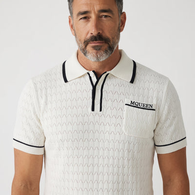 White Alexander McQueen short-sleeve knit polo with navy trim and chest pocket embroidered MCQUEEN