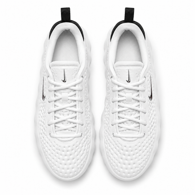 White Nike low-top perforated sneaker with black heel and podded sole