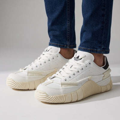 White Adidas Stan Smith low-top sneakers with cream chunky sole and black heel tab
