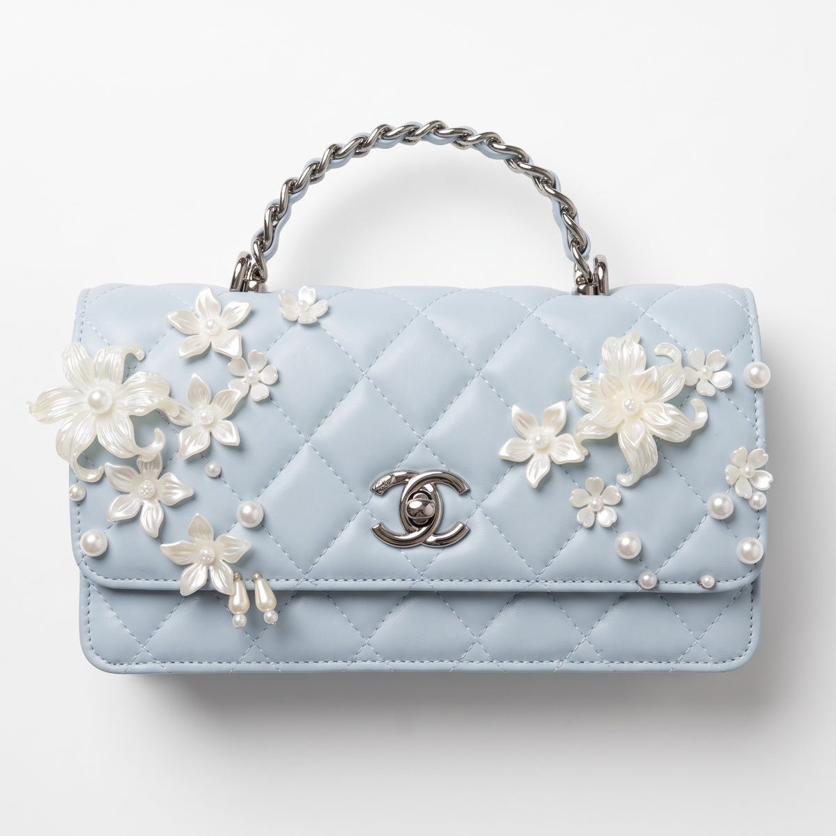 Chanel baby blue quilted mini flap bag with pearlescent floral appliqués and chain top handle