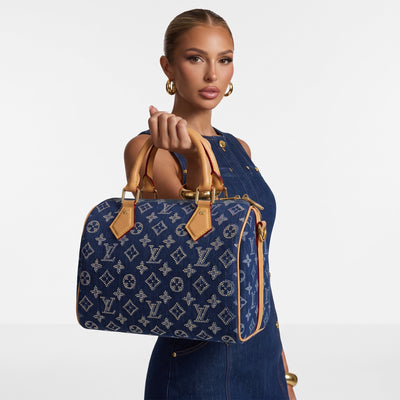 Blue denim Louis Vuitton top-handle tote with tan trim and crystal-studded monogram