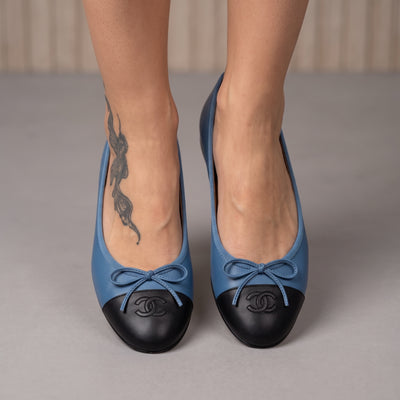 Chanel two-tone blue and black ballet flats with stitched CC logo on cap toe