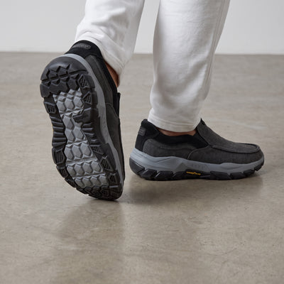 charcoal grey Skechers slip-on trainer with chunky grey lug sole and Goodyear logo
