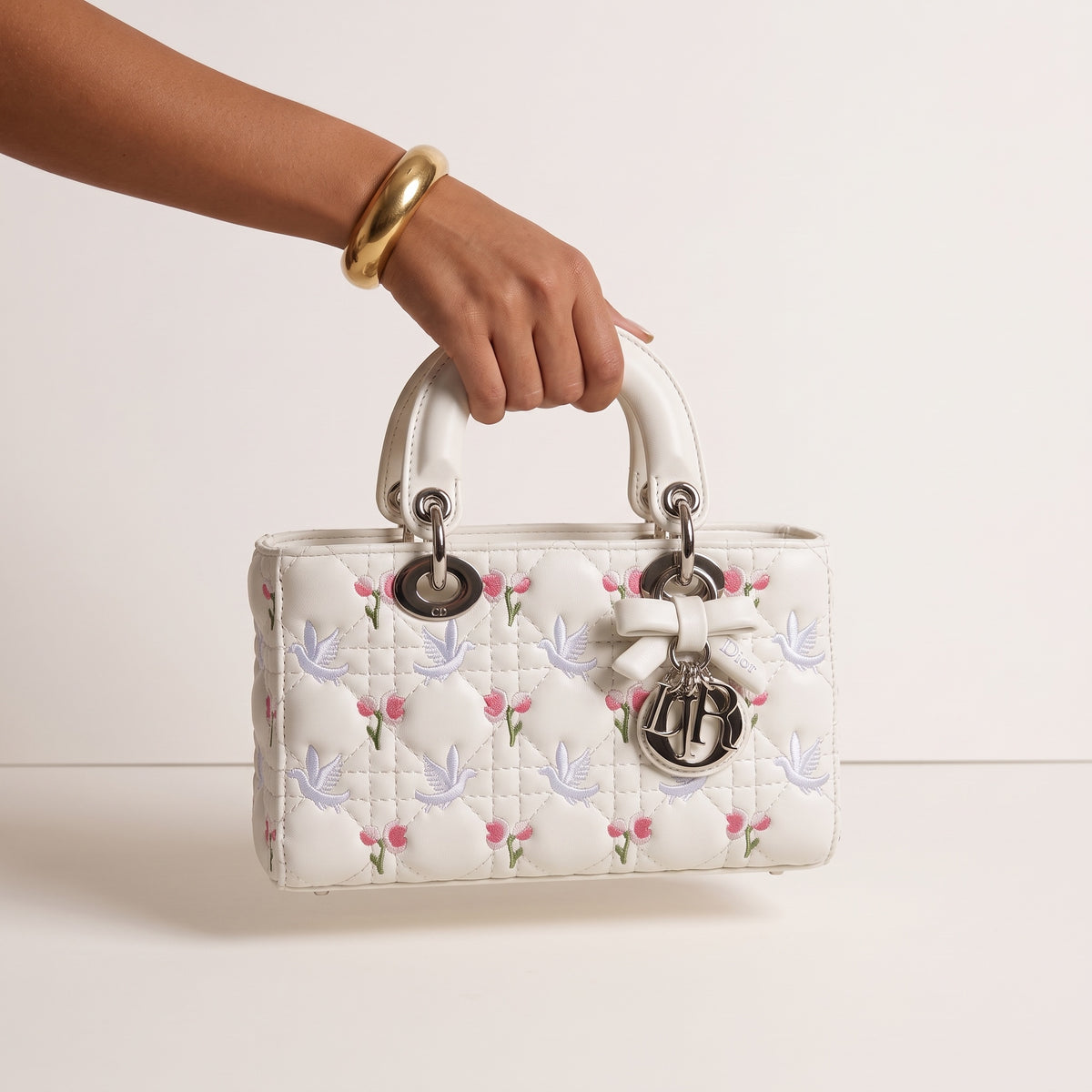 White Lady Dior top-handle tote with embroidered birds and flowers and Dior charm