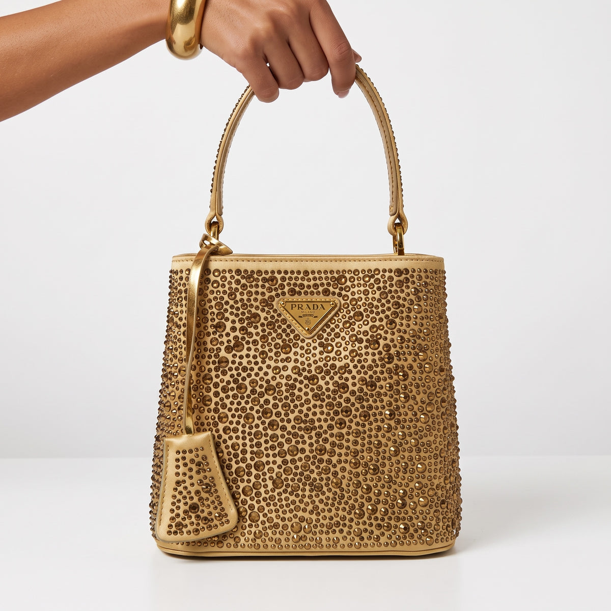 Prada gold studded top-handle shoulder bag with triangular logo plaque