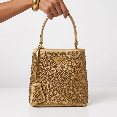 Prada gold studded top-handle shoulder bag with triangular logo plaque