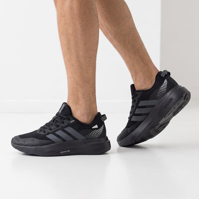 adidas adizero all-black running sneakers shown on model feet