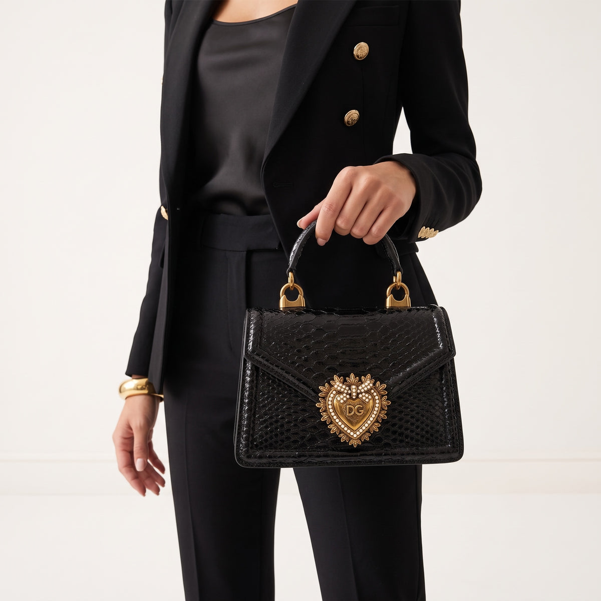 Dolce & Gabbana small black devotion top-handle bag with gold heart emblem