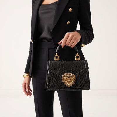 Dolce & Gabbana small black devotion top-handle bag with gold heart emblem