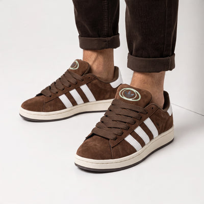 brown Adidas Campus sneaker with white stripes and cream sole