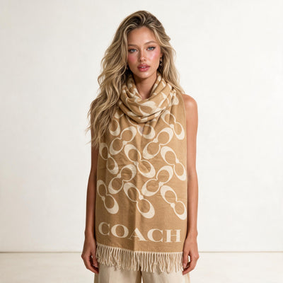 Tan Coach scarf with cream repeating logo and fringed ends
