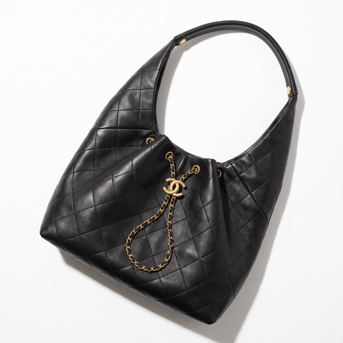 Black quilted Chanel hobo bag with gold CC charm and chain