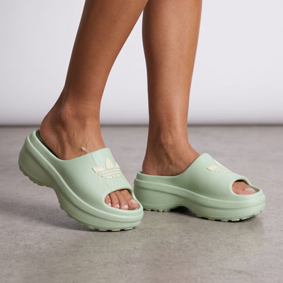 mint green adidas chunky platform slide with open toe and trefoil logo