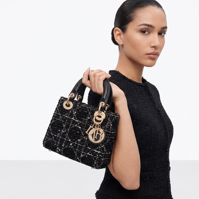 Dior Lady Dior mini top-handle bag in black tweed with gold hardware and Dior letter charms