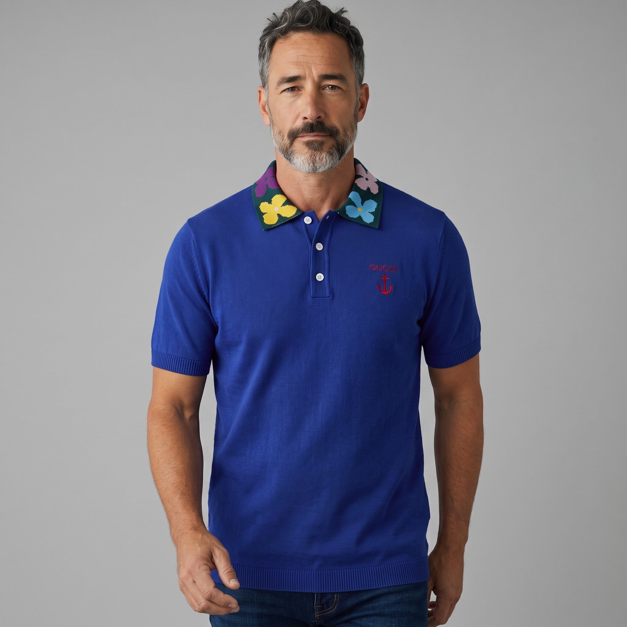Men's royal blue Gucci polo with multicolour floral knit collar and embroidered chest logo