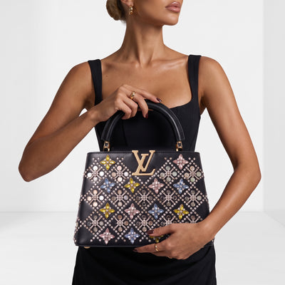 Louis Vuitton black Capucines top-handle bag with crystal floral embellishments and gold LV plaque