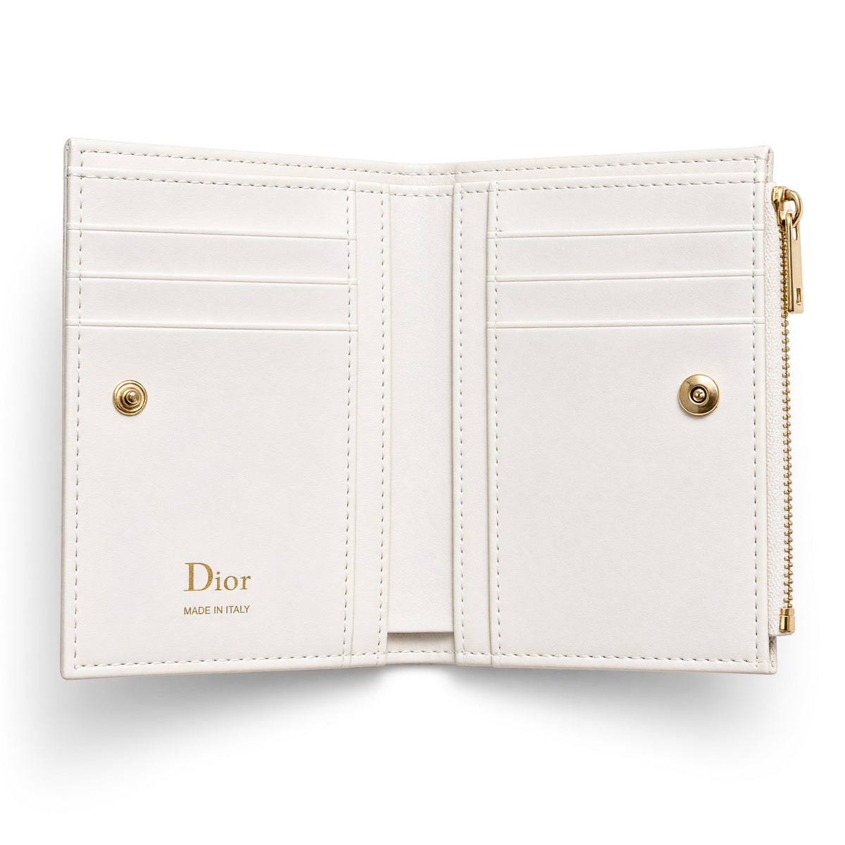 Dior compact wallet with bow and patterned exterior, open showing card slots and gold zipper