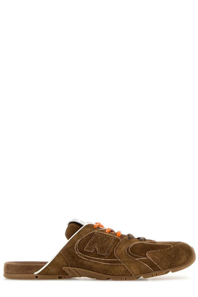brown suede Miu Miu open-back mule sneaker with orange laces and branded tongue