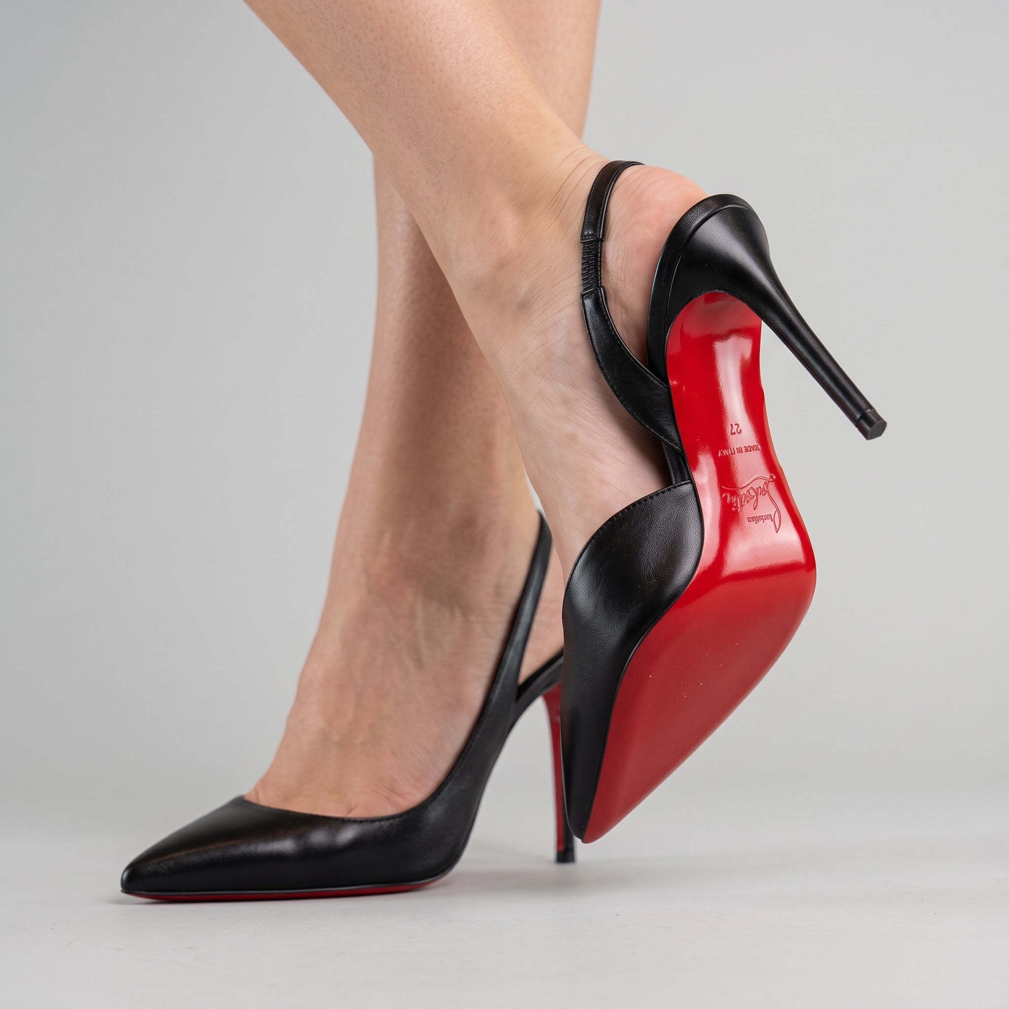 Black slingback pointed pumps with red sole