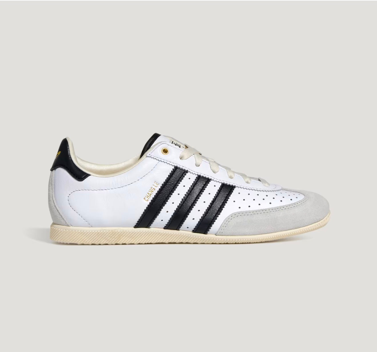 Adidas Chang Le white trainer with black stripes and pale grey suede toe