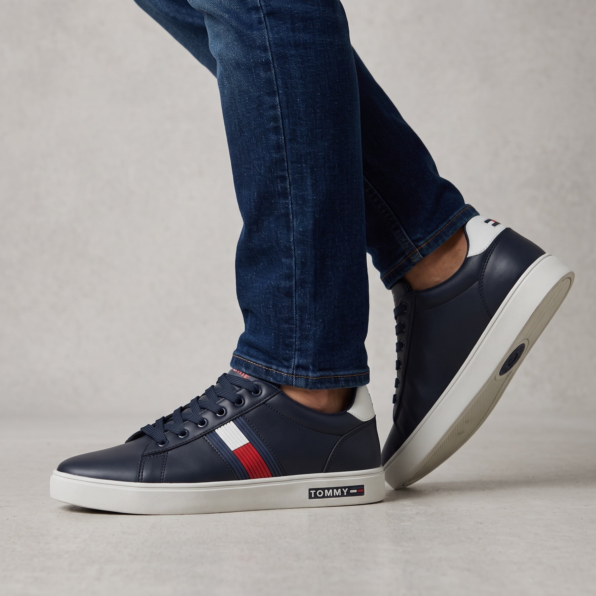 Tommy Hilfiger navy low-top sneakers with red white blue stripe and white sole