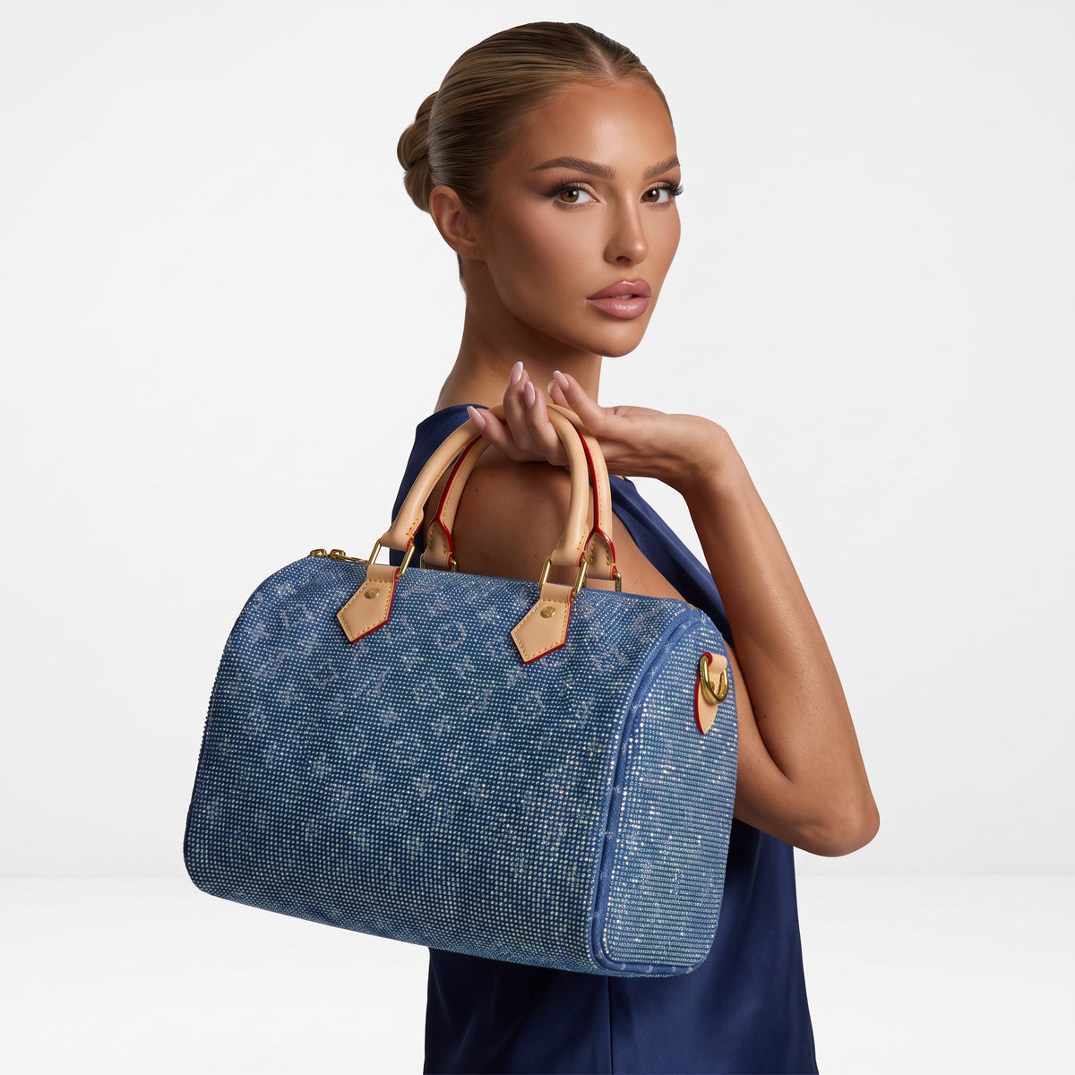 Blue Louis Vuitton monogram top-handle bag with crystal-like embellishment and beige handles