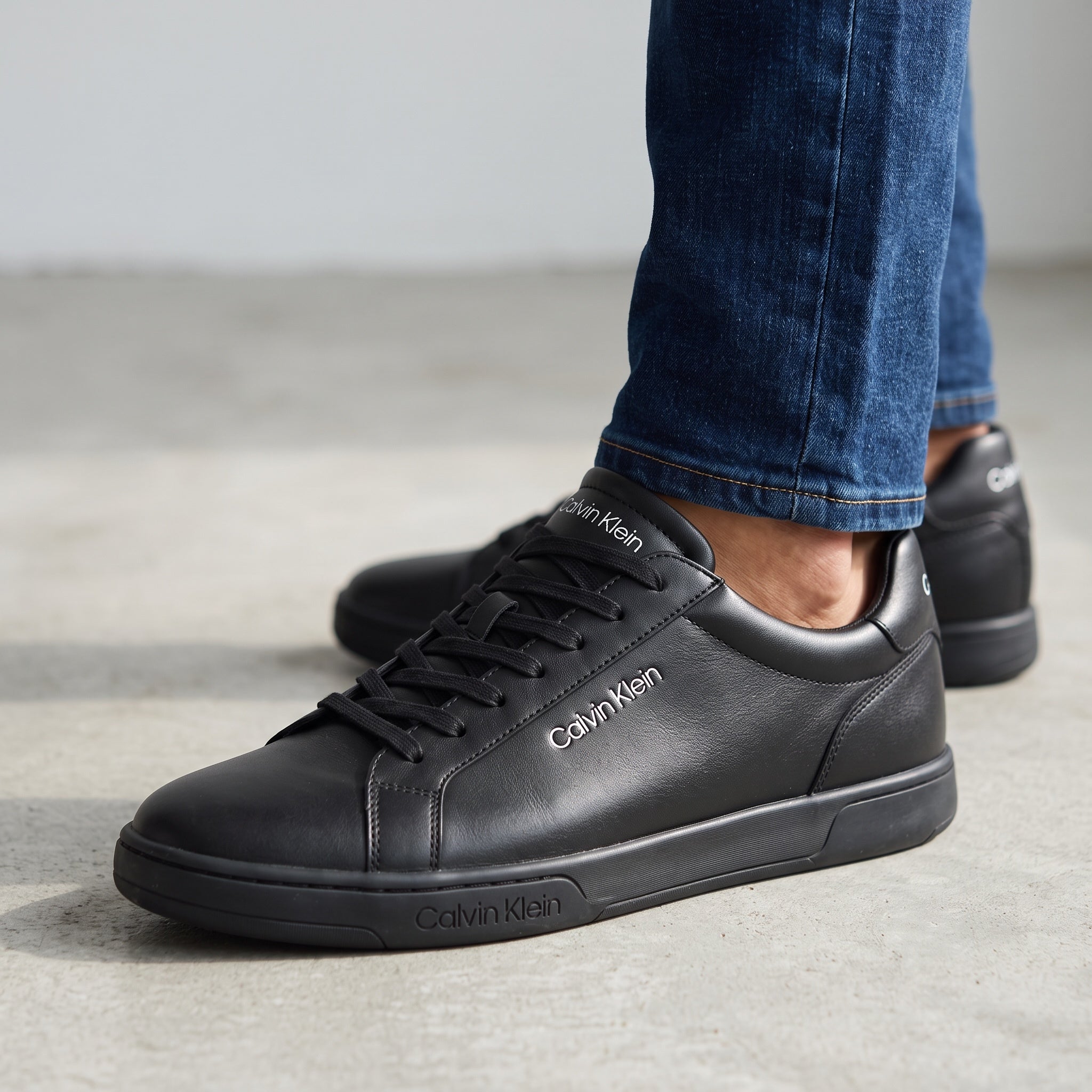 Calvin Klein black low-top sneakers with textured pebbled upper