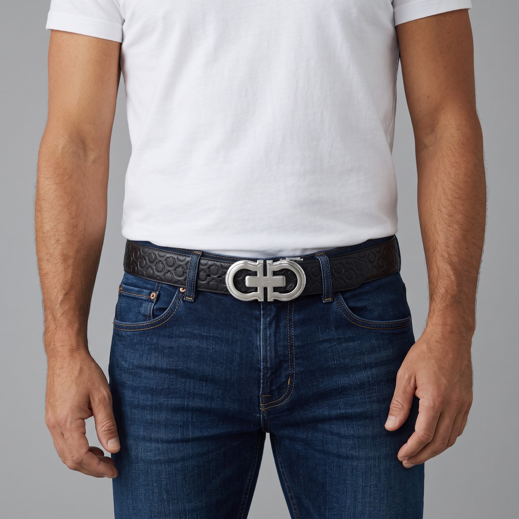 Black Ferragamo Gancini belt with silver Gancini buckle worn with jeans