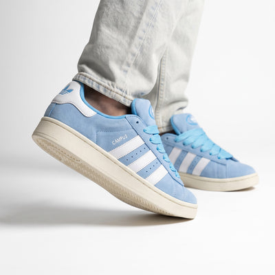 Light blue Adidas Campus low sneakers with white stripes and cream sole