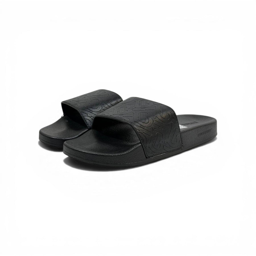 Burberry Embossed Monogram Slide Sandals — Black
