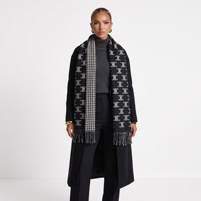Black Celine scarf with repeating Triomphe logo and check reverse, fringed ends