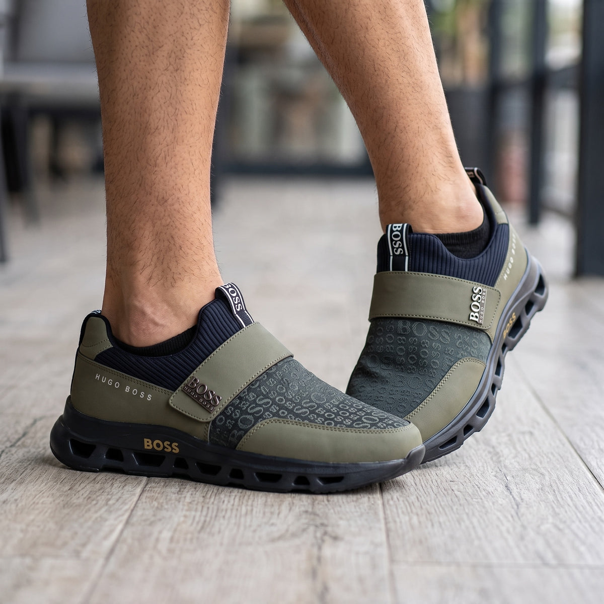 Hugo Boss olive green slip-on sneakers with tonal logo print and chunky ventilated sole